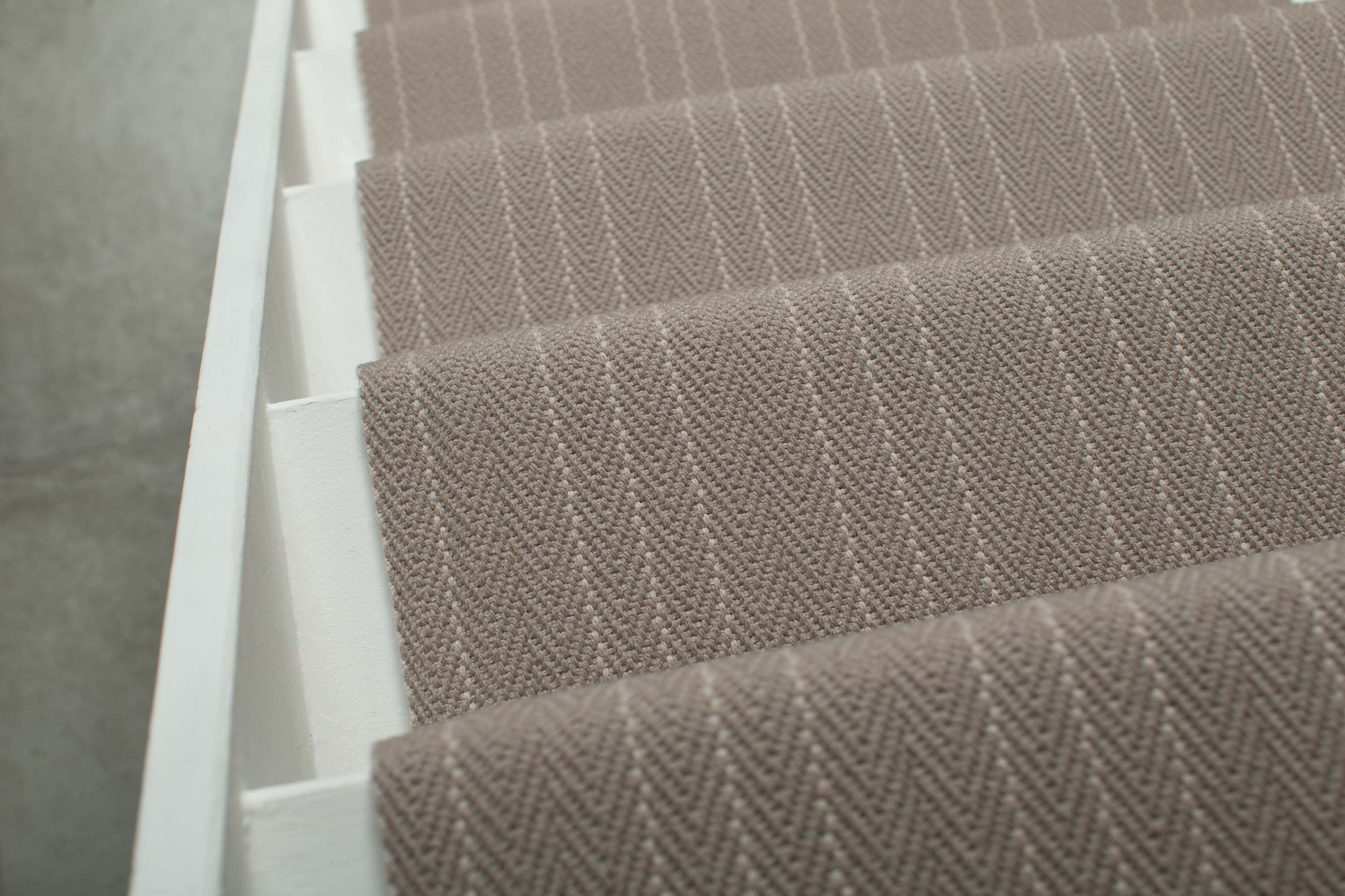 Striped flatweave runner in light grey on white staircase