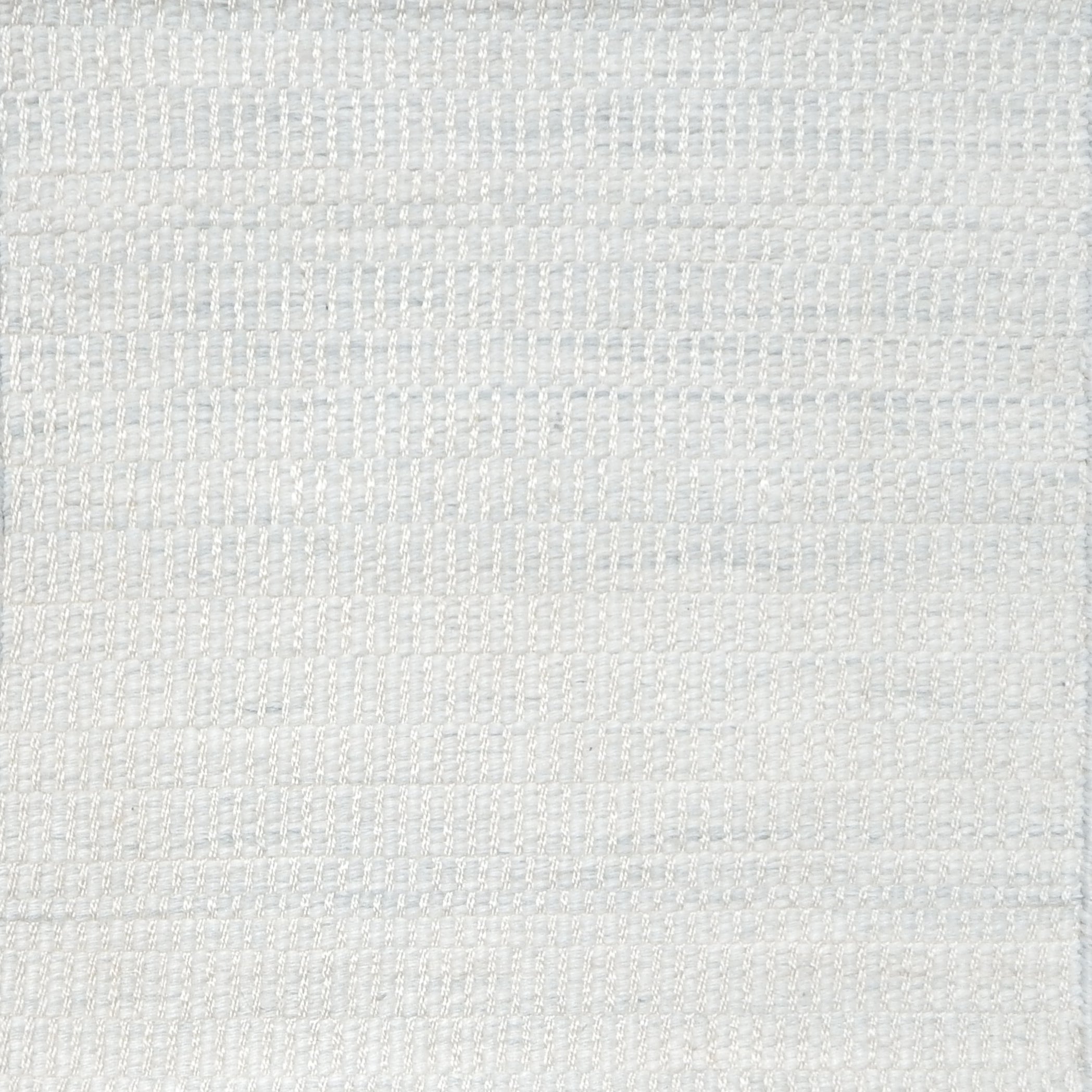 Textural woven carpet in pale sky blue