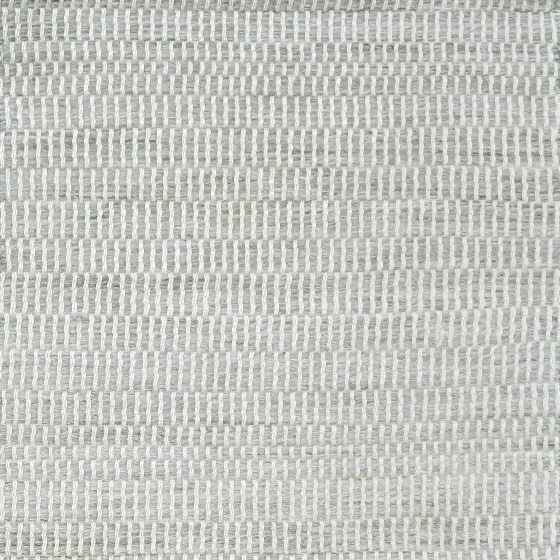Textural woven carpet in sage green