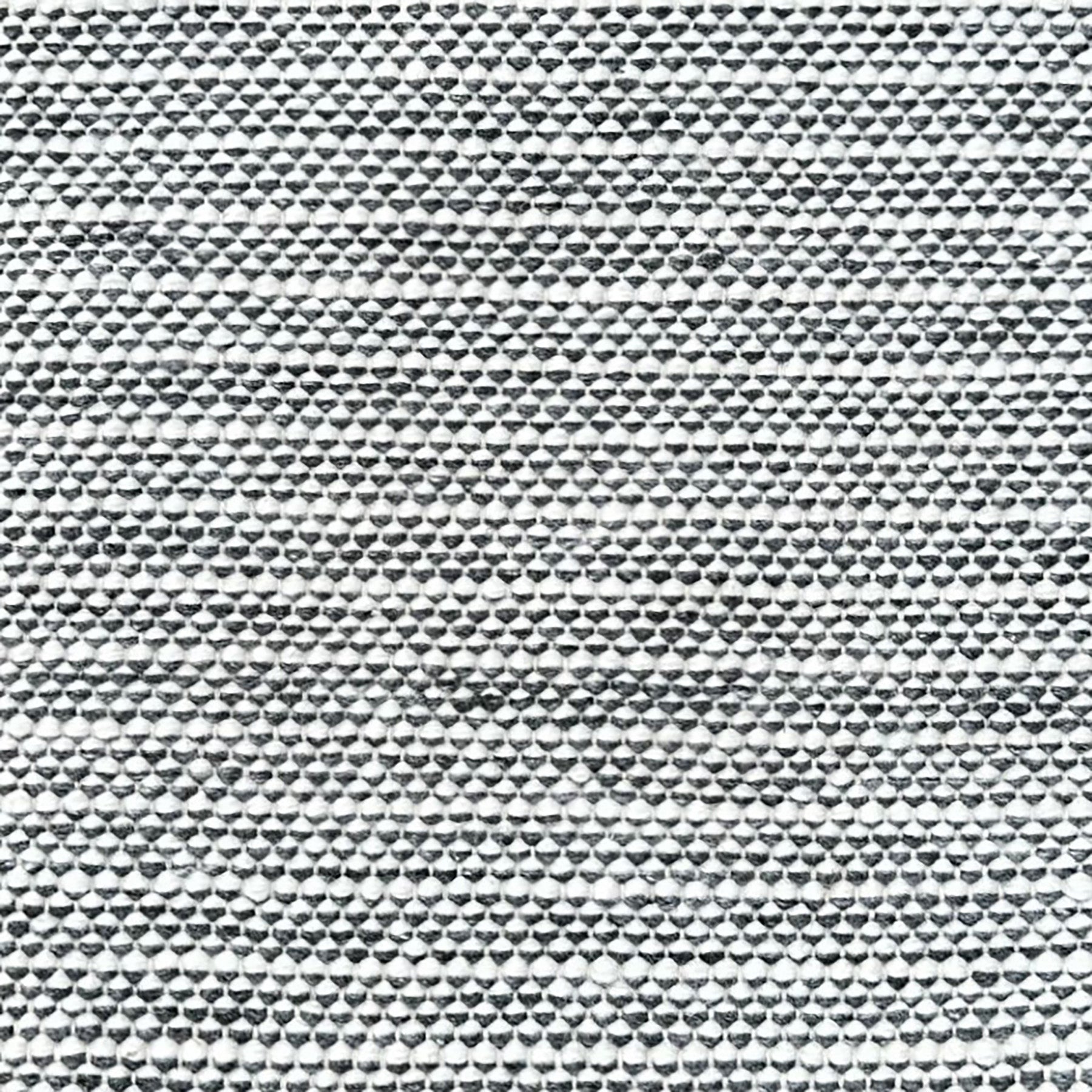 Striped black and white woven rug.