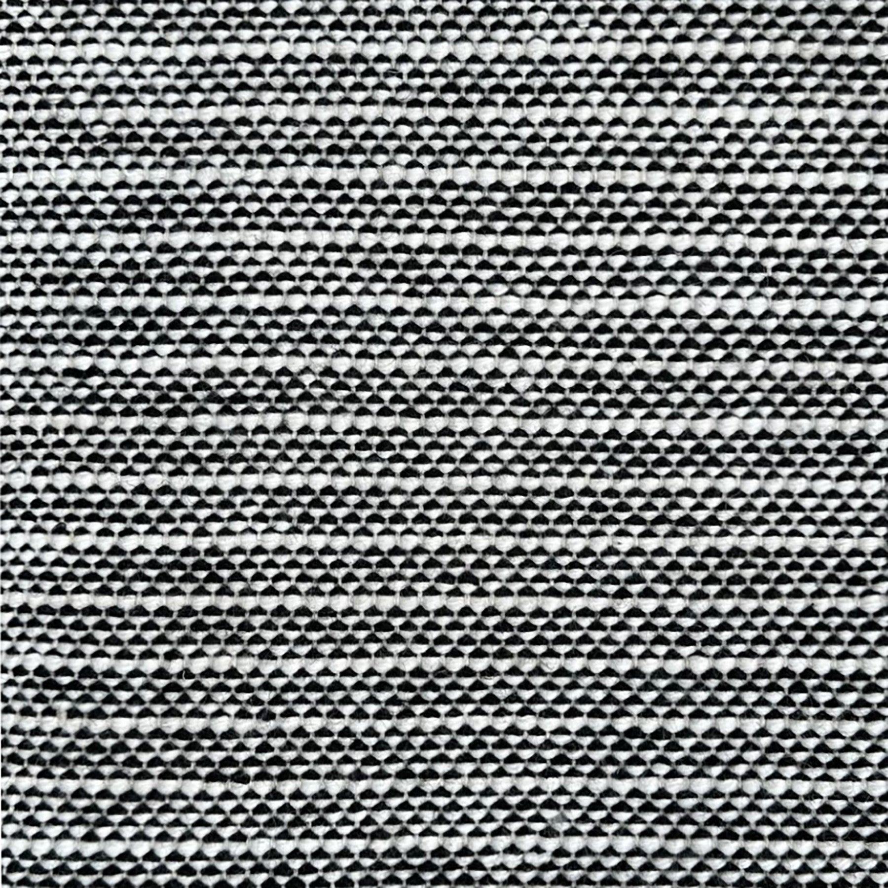 Black and white striped woven rug