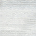Close-up of a textured light gray woven rug