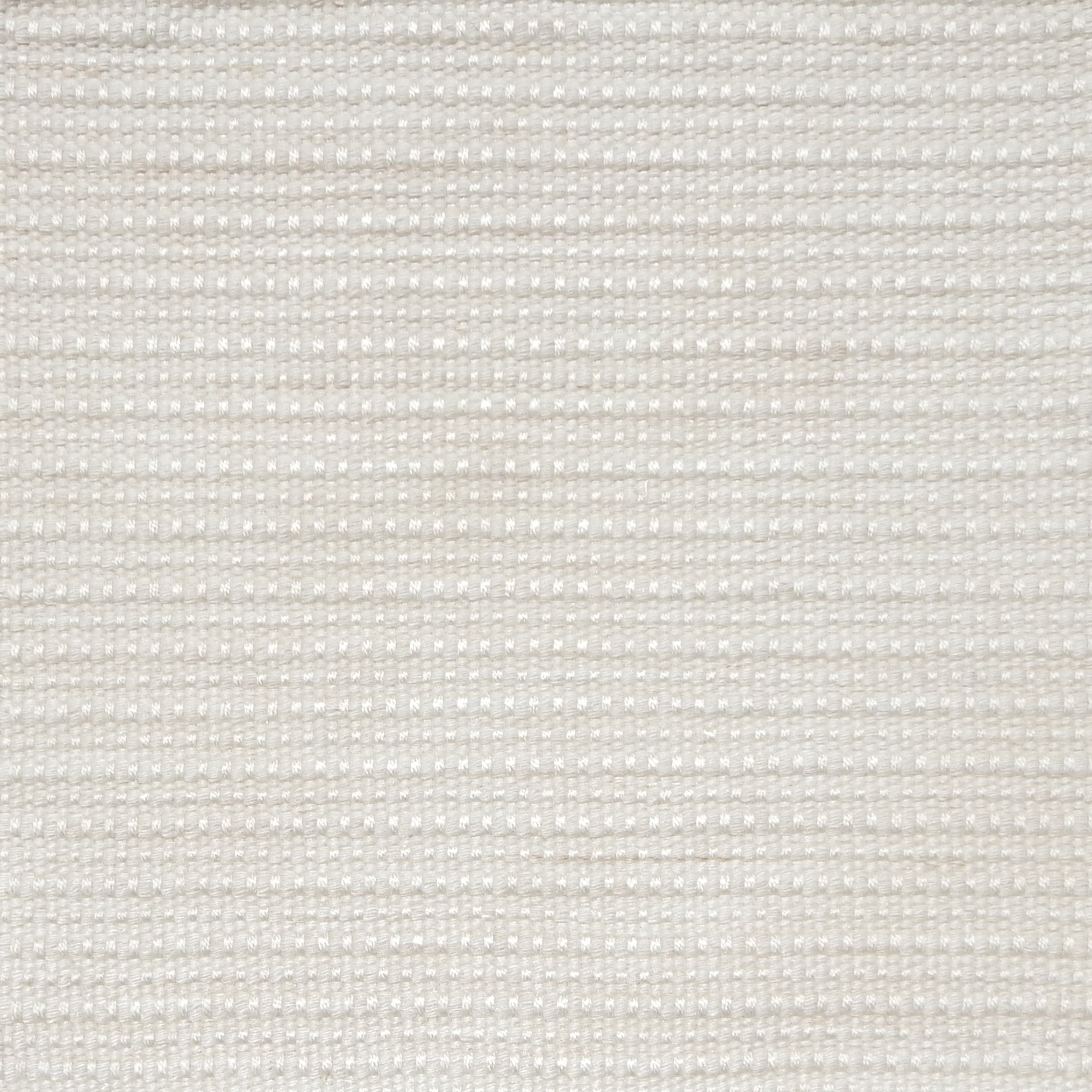 Close-up of a cream textured woven rug