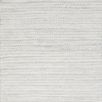 Close-up of white textured woven rug