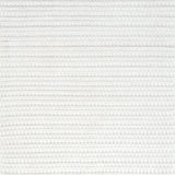 Close-up of bright white textured woven rug