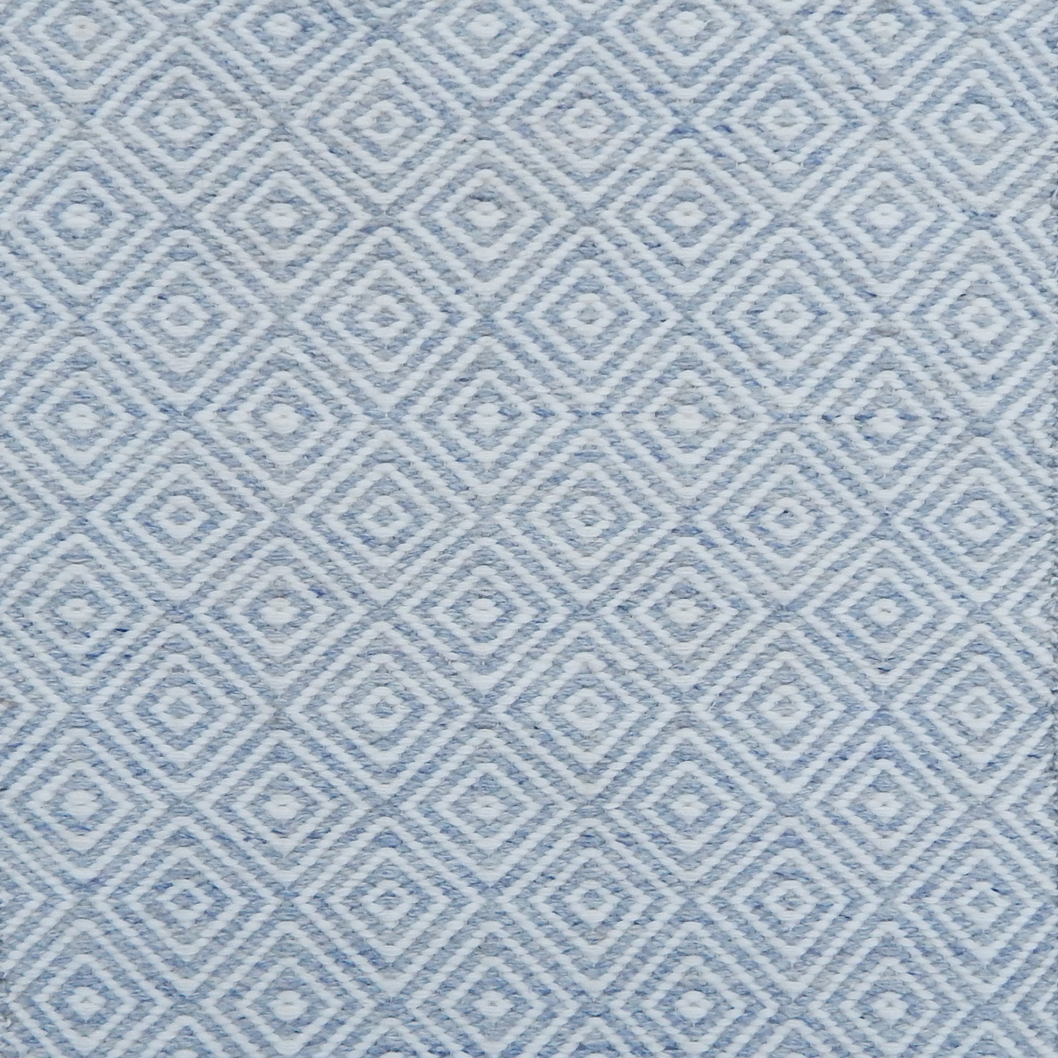Blue and white diamond pattern flatweave rug. 