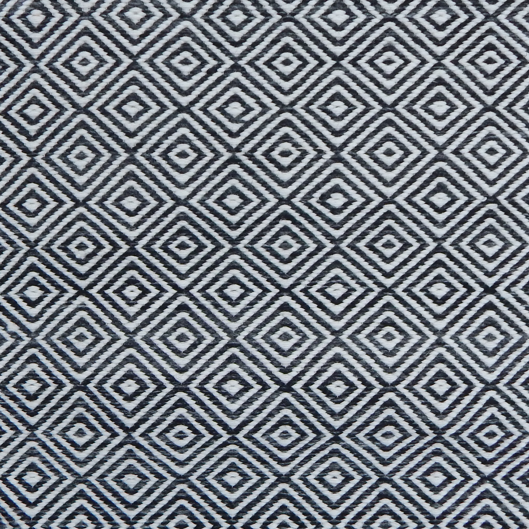 Patterned rug with black and white geometric design