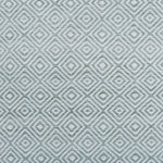 Patterned rug with geometric design in light green color