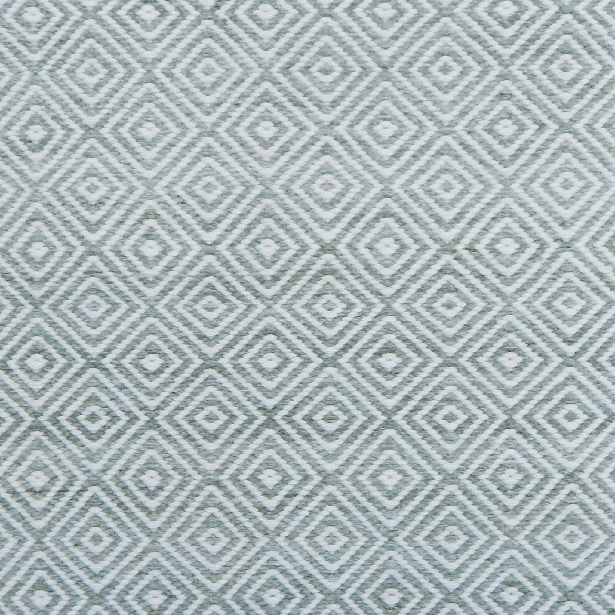 Patterned rug with geometric design in light green color