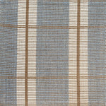Woven rug with plaid pattern in blue, beige, and white