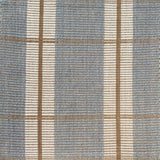 Woven rug with plaid pattern in blue, beige, and white