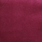 Detail of velvet fabric yardage in dark red.