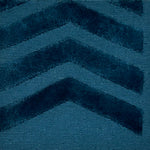 Teal blue rug with chevron pattern