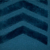 Teal blue rug with chevron pattern