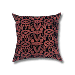Square throw pillow in a repeating abstract block print pattern in mottled coral on a black field.