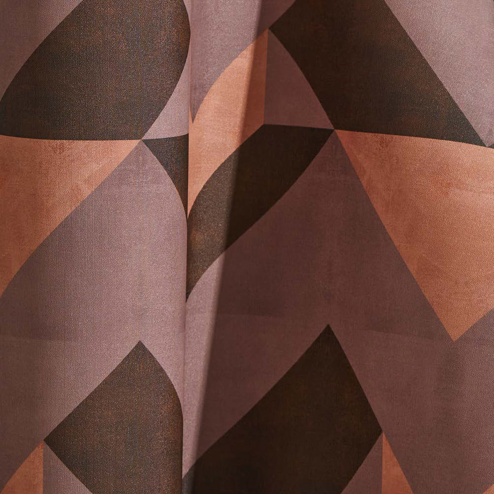Draped wallpaper yardage in a dense geometric print in shades of peach, purple and brown.