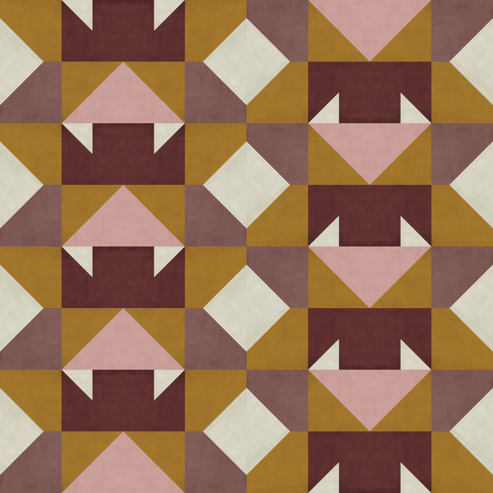 Detail of a geometric pattern of triangles and squares in mauve, ochre, cream, pink and maroon.