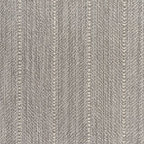 Close up of a broadloom carpet with a herringbone stripe in grey.