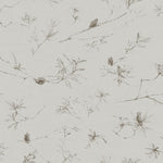 Detail of wallpaper in a painterly pine cone and branch print in gray on a greige field.