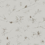 Detail of wallpaper in a painterly pine cone and branch print in gray on a greige field.