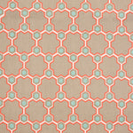 Detail of fabric in a geometric honeycomb pattern in shades of tan, white, blue and coral.