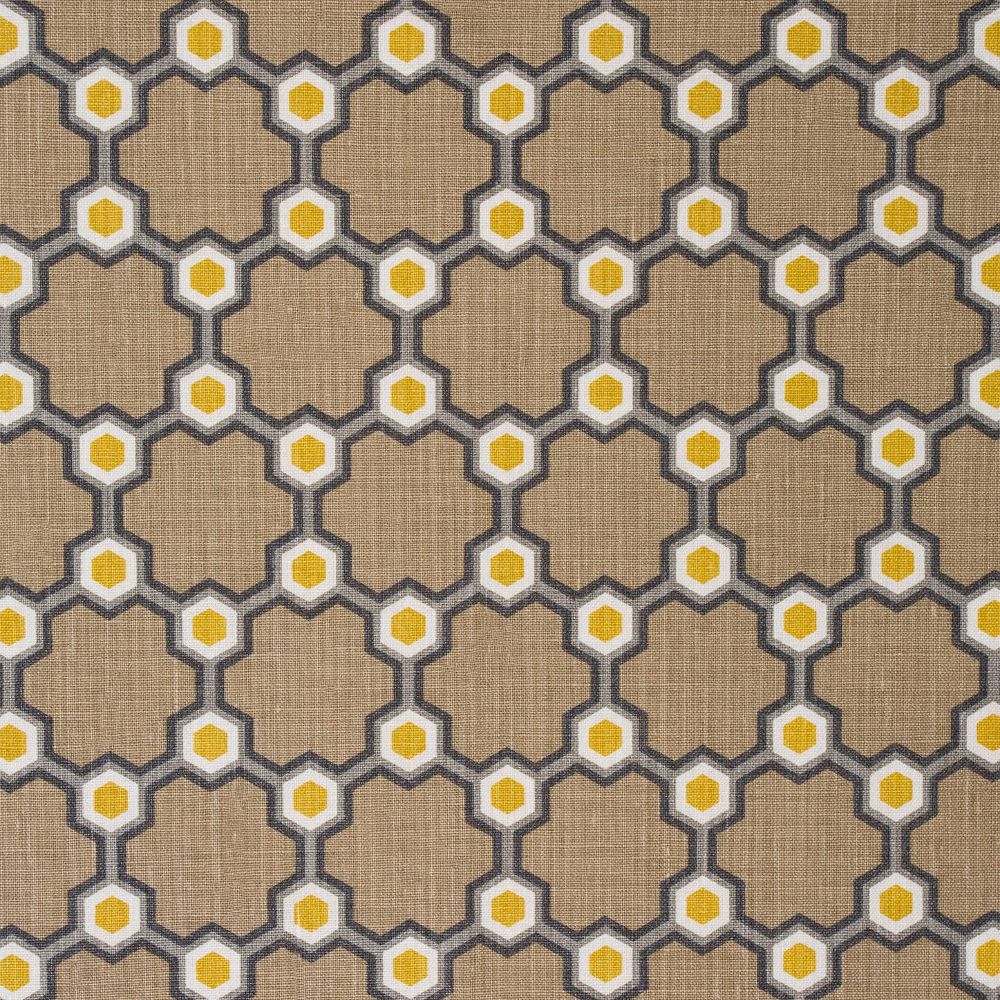 Detail of fabric in a geometric honeycomb pattern in shades of brown, yellow and gray.