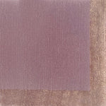 Handknotted carpet with contrast border in pastel purple. 