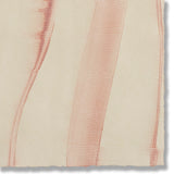 Detail of a handmade wallpaper swatch with an irregular combed stripe pattern in pink on a tan field.