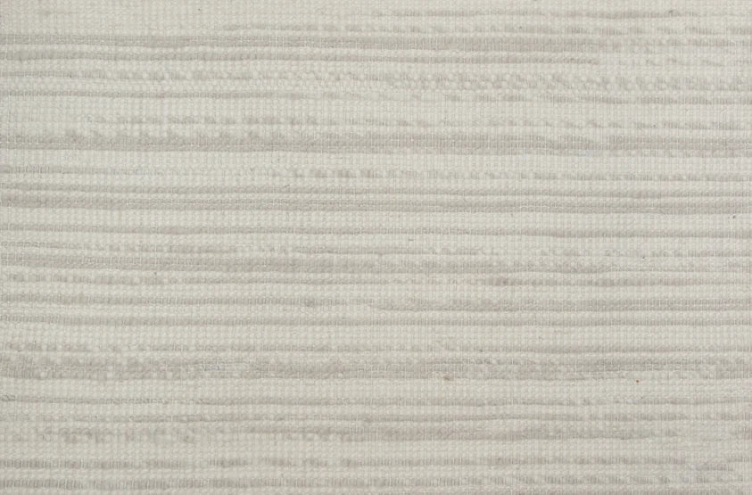 Broadloom carpet in a striped pattern in a light grey cream design