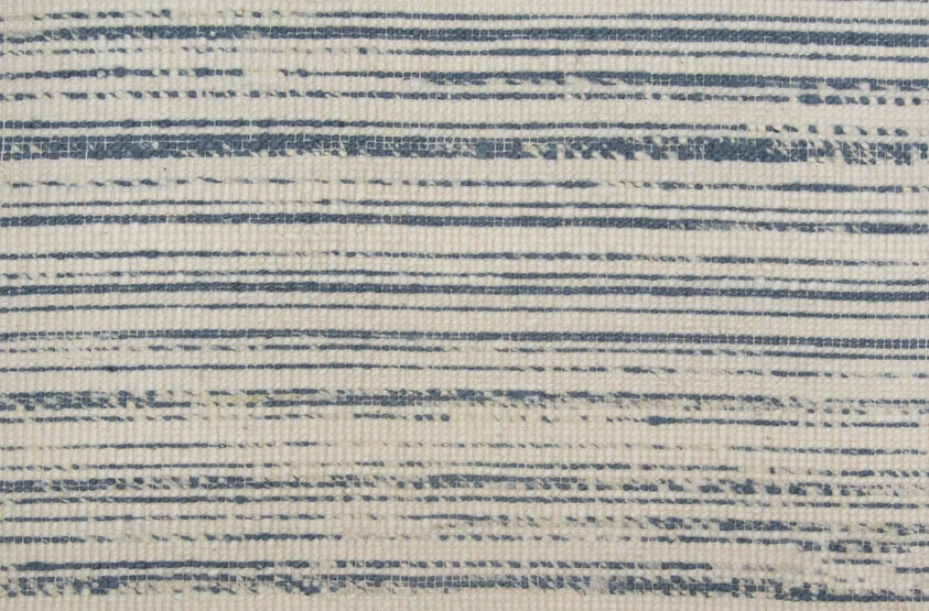 Broadloom carpet in a striped pattern in a blue white design