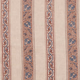 Detail of fabric in a striped paisley print in blue and brown on a cream field.