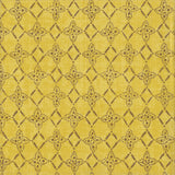 Detail of fabric in a botanical lattice print in brown on a mottled yellow field.