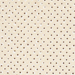 Detail of fabric in a painterly dot print in white and brown on a cream field.