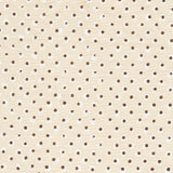 Detail of fabric in a painterly dot print in white and brown on a cream field.