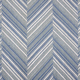 Broadloom carpet with a graphic herringbone pattern in shades of light blue and white. 