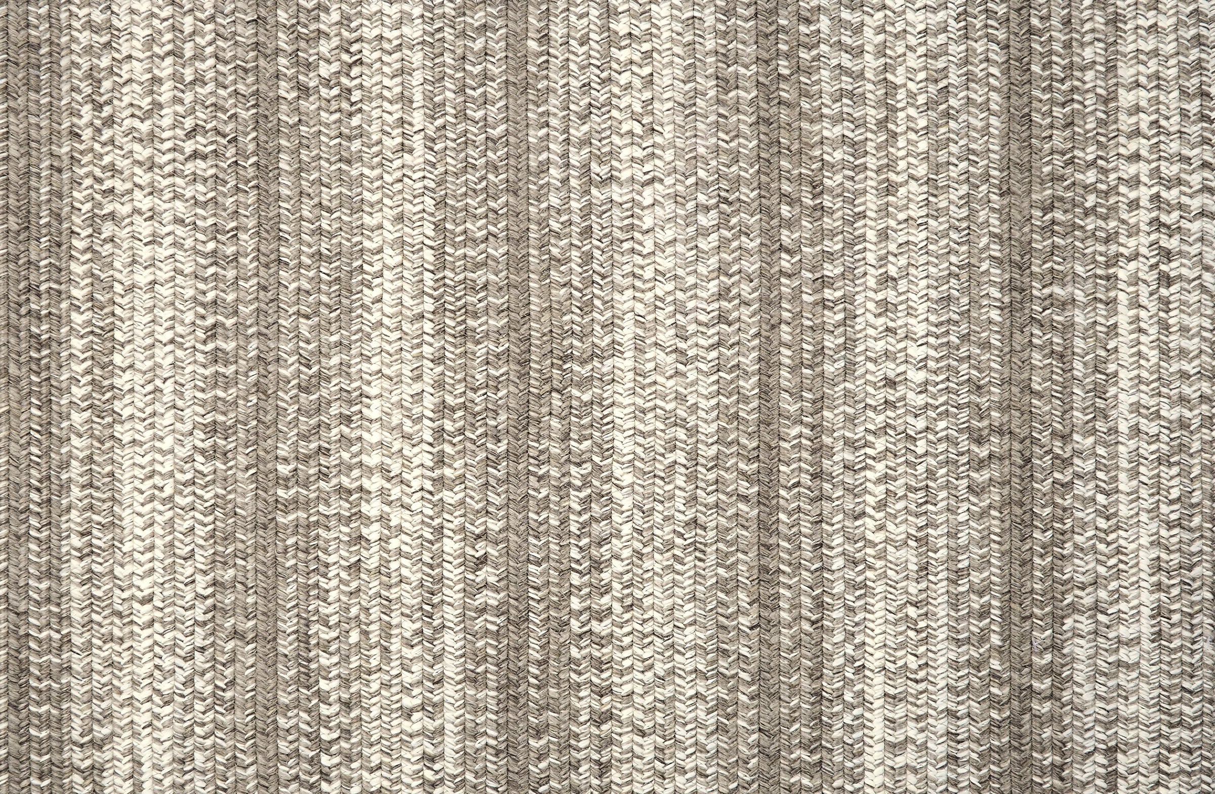 Broadloom carpet in a textural braided stripe in cream and grey.