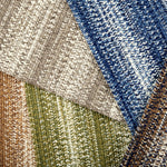 Broadloom carpet swatches in textural braid pattern in various colors. 
