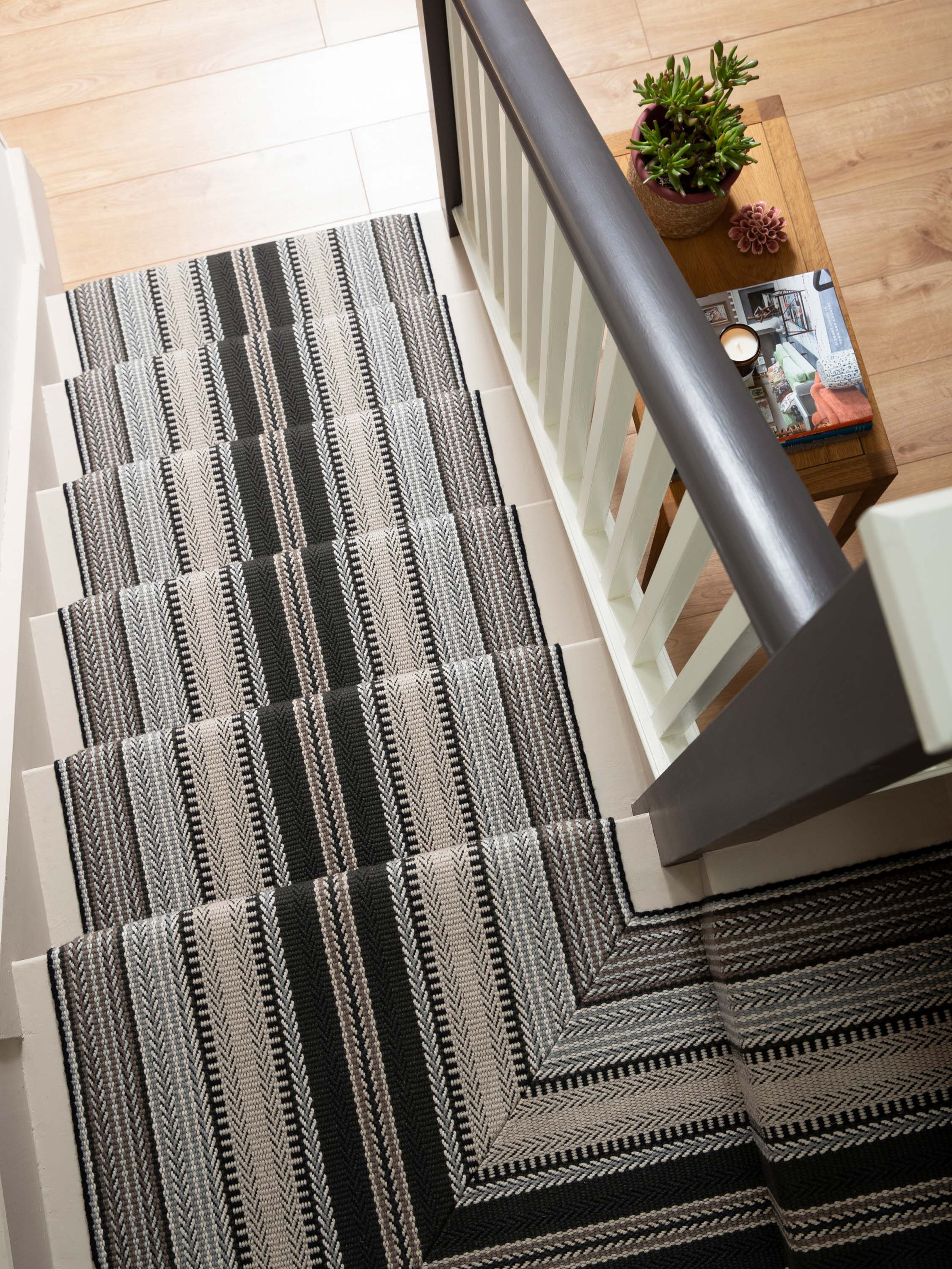 Striped flatweave runner in black white and grey on white staircase