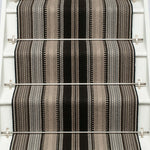 Striped flatweave runner in black white and grey on white staircase