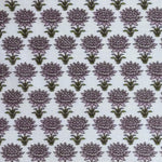 Pattern of purple flowers with green stems on a light blue background