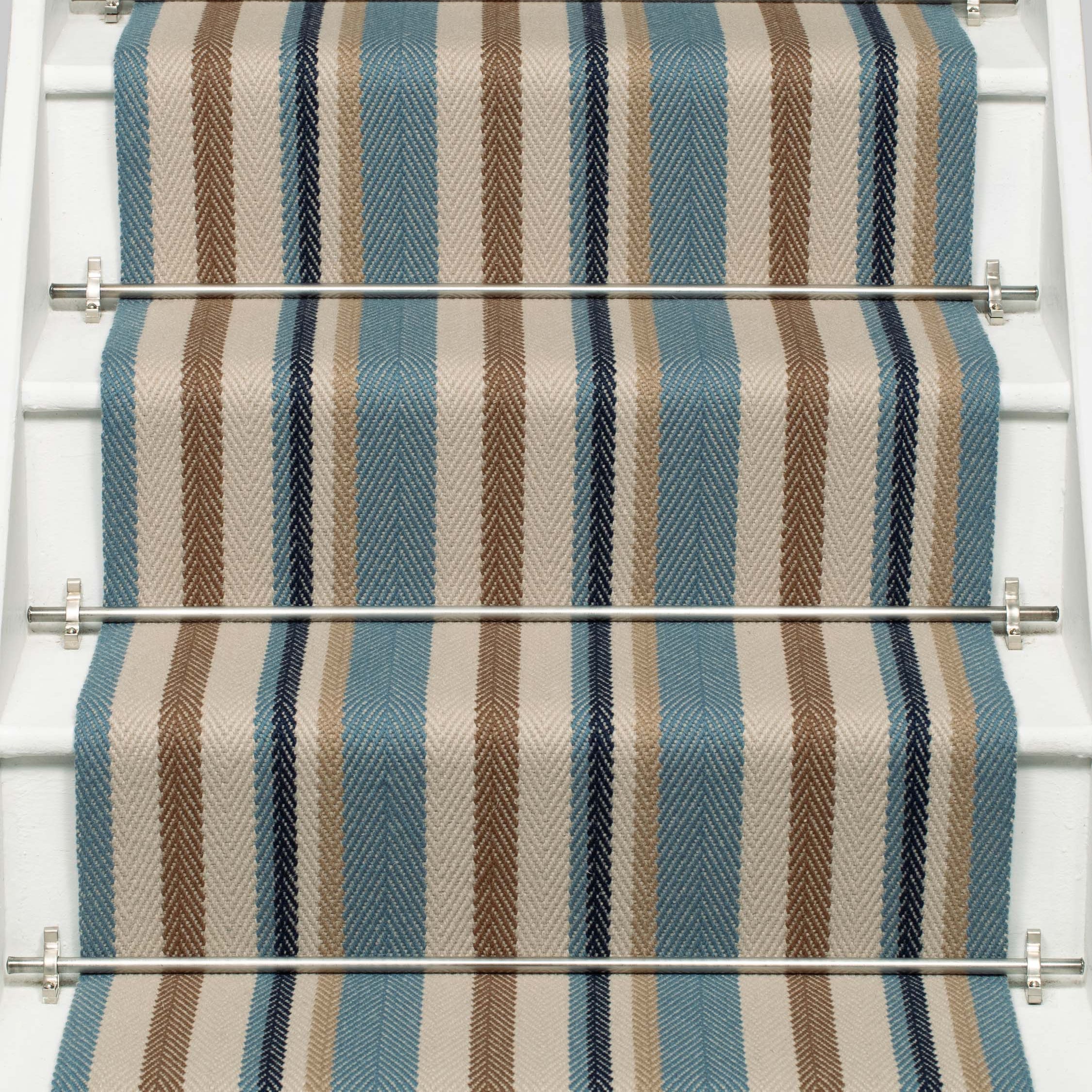 Striped flatweave runner in blue tan cream and black on white staircase