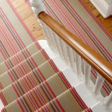 Striped flatweave runner in blue orange green and red on white staircase