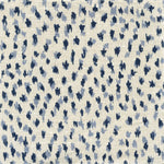 Fabric in a cheetah print in blue and navy on a cream field.