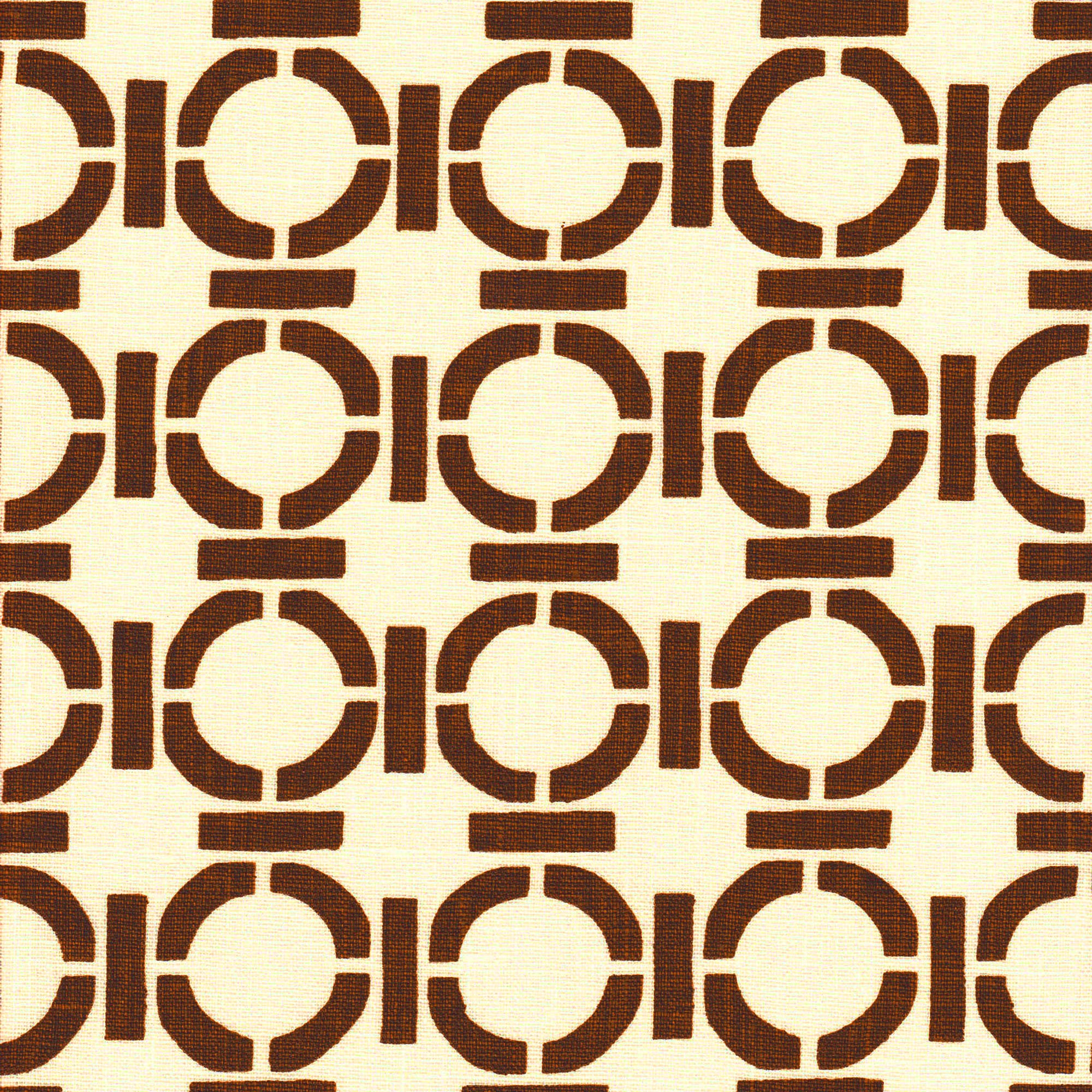 Detail of fabric in a round geometric grid print in brown on a cream field.