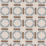 Detail of fabric in a round geometric grid print in light brown and blue on a tan field.