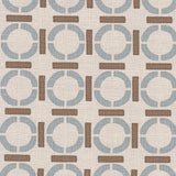 Detail of fabric in a round geometric grid print in light brown and blue on a tan field.