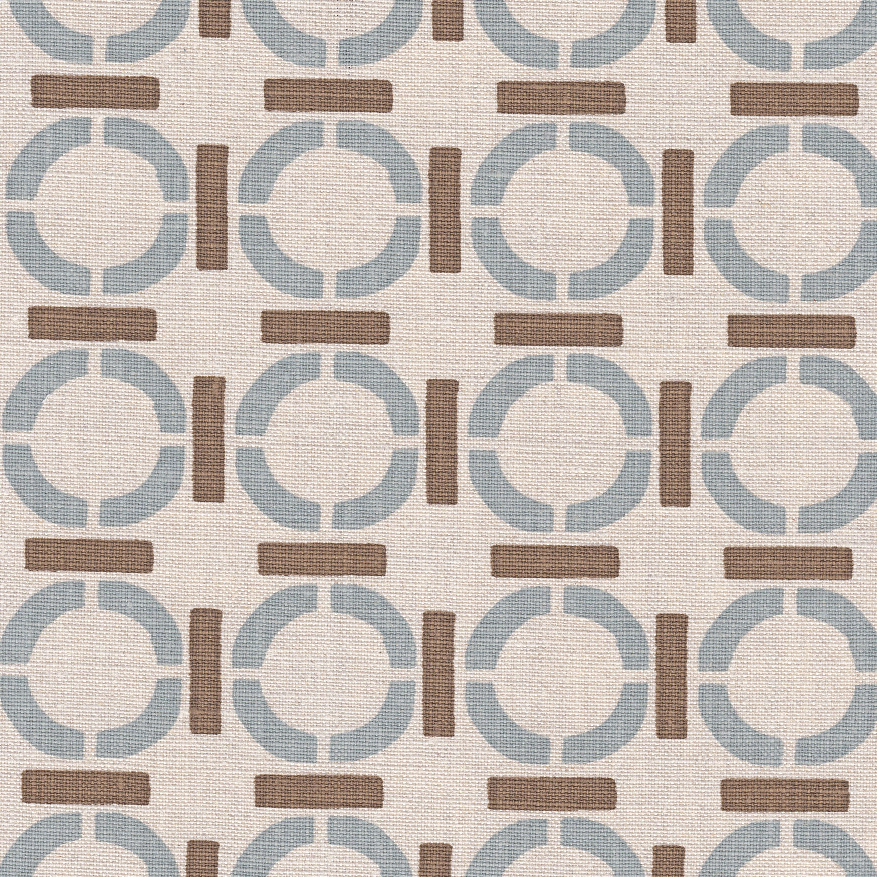 Detail of fabric in a round geometric grid print in light brown and blue on a tan field.