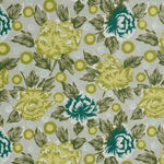 Detail of a printed linen fabric in a repeating china rose pattern in shades of yellow, blue and green on a gray field.