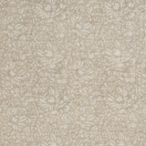 Detail of a printed linen fabric in a repeating chrysanthemum pattern in white on a cream field.