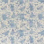 Printed linen fabric in a repeating flower and butterfly pattern in misty blue on a cream field.